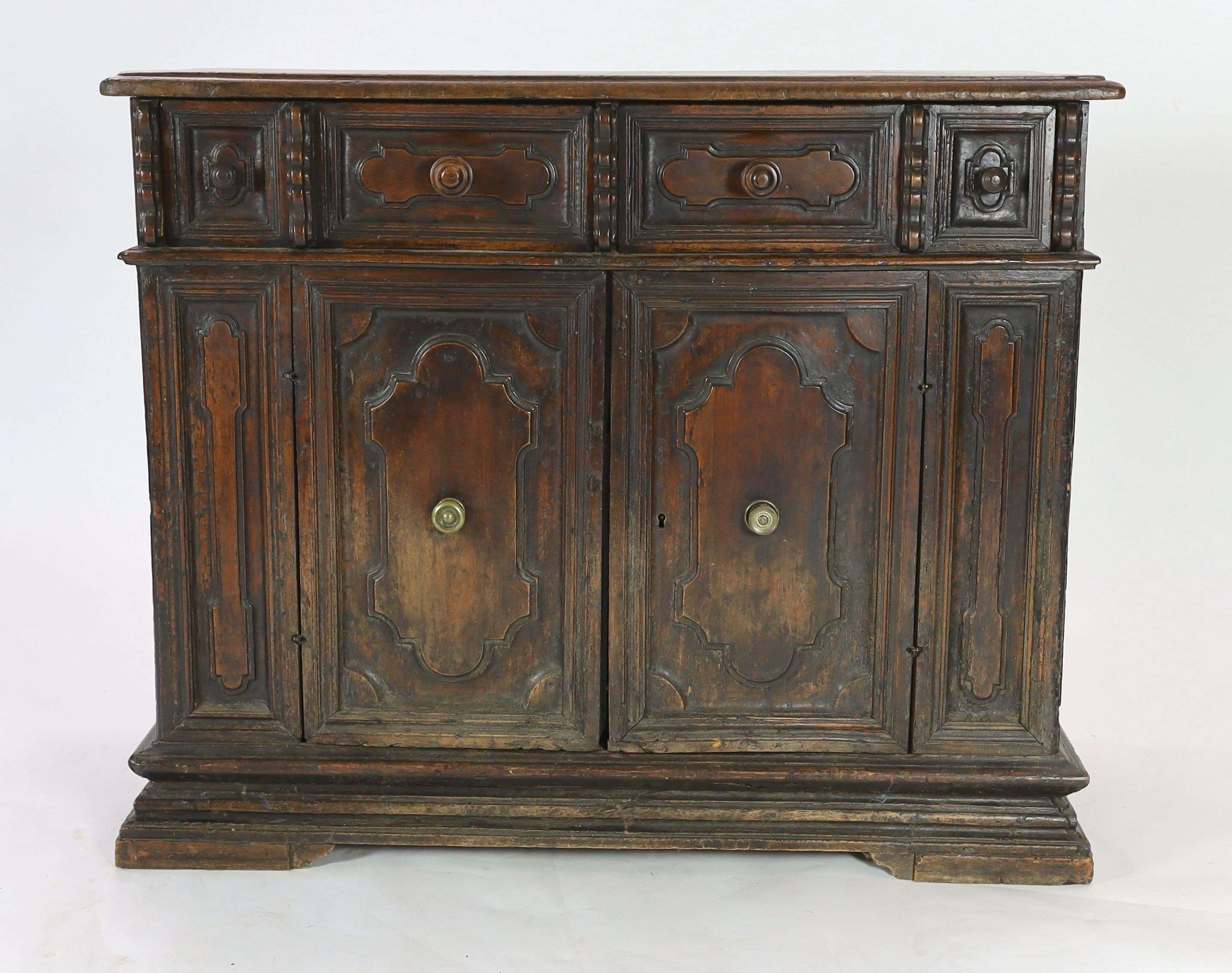 A 17th century Tuscan walnut credenza, W.131cm D.52cm H.105cm